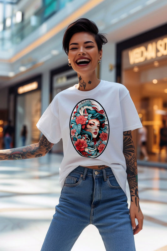 young tattooed woman wearing a white graphic t-shirt featuring a woman head with flowers print