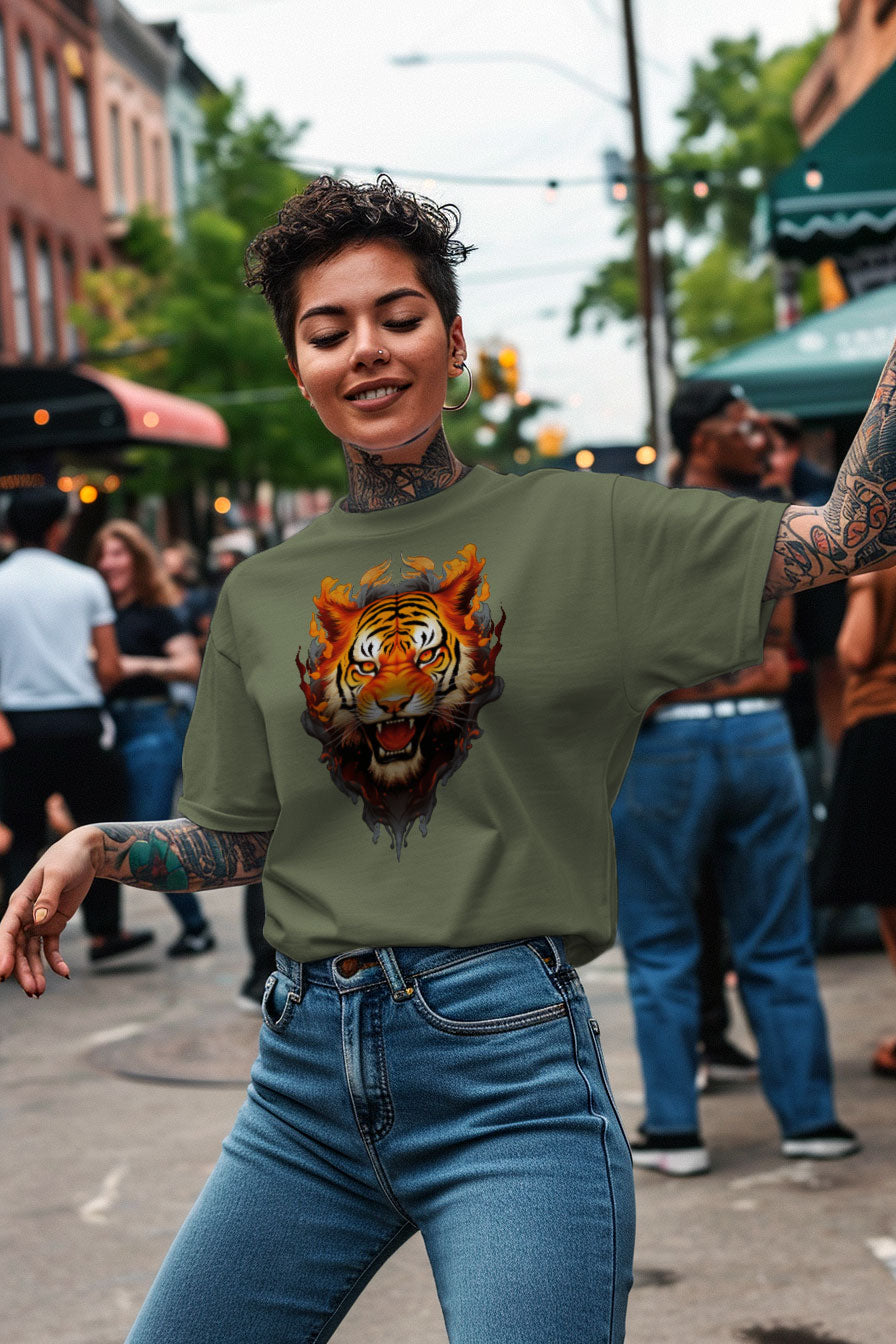 young tattooed woman wearing a green graphic t-shirt featuring a Tiger print