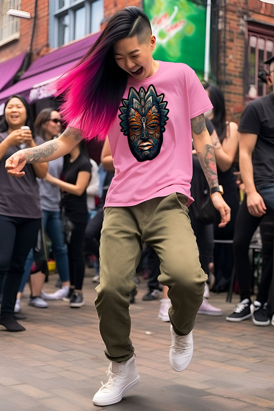 young tattooed woman wearing an Azalea-pink graphic t-shirt featuring an African mask print