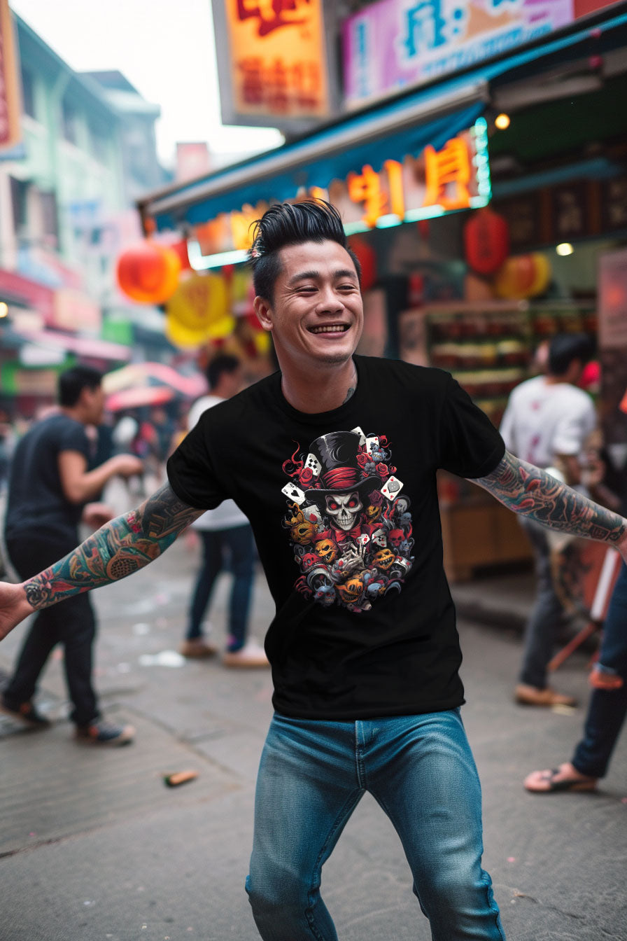 young tattooed man wearing a black graphic t-shirt featuring a skull with a hat print