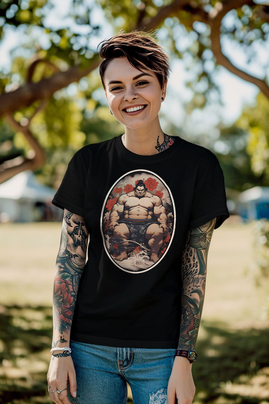 young tattooed woman wearing a black graphic t-shirt featuring a Sumo fighter print
