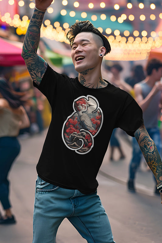 young tattooed man wearing a black graphic t-shirt featuring a Crane with cherry blossom trees print