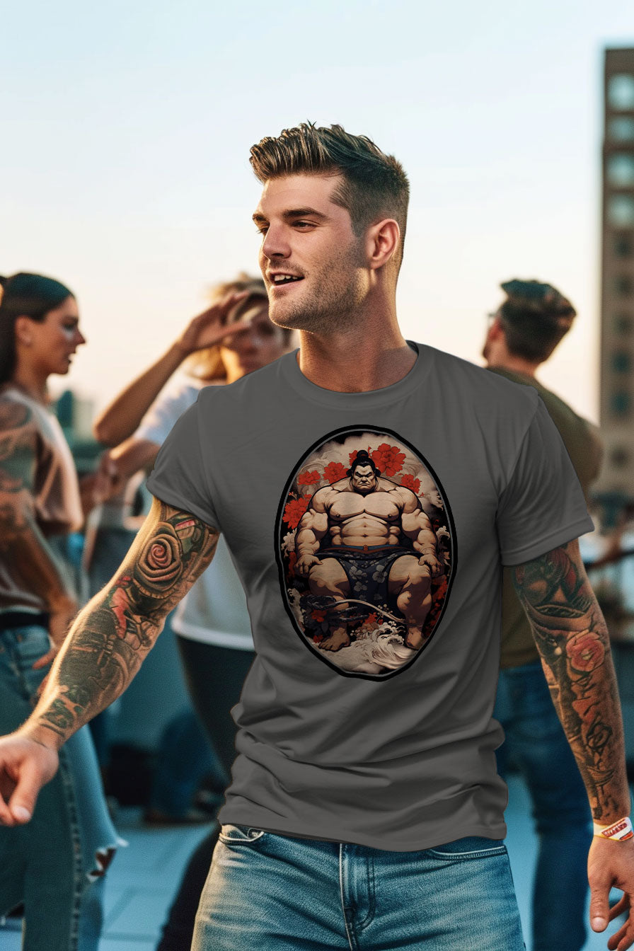 young tattooed man wearing a gray graphic t-shirt featuring a Sumo fighter print