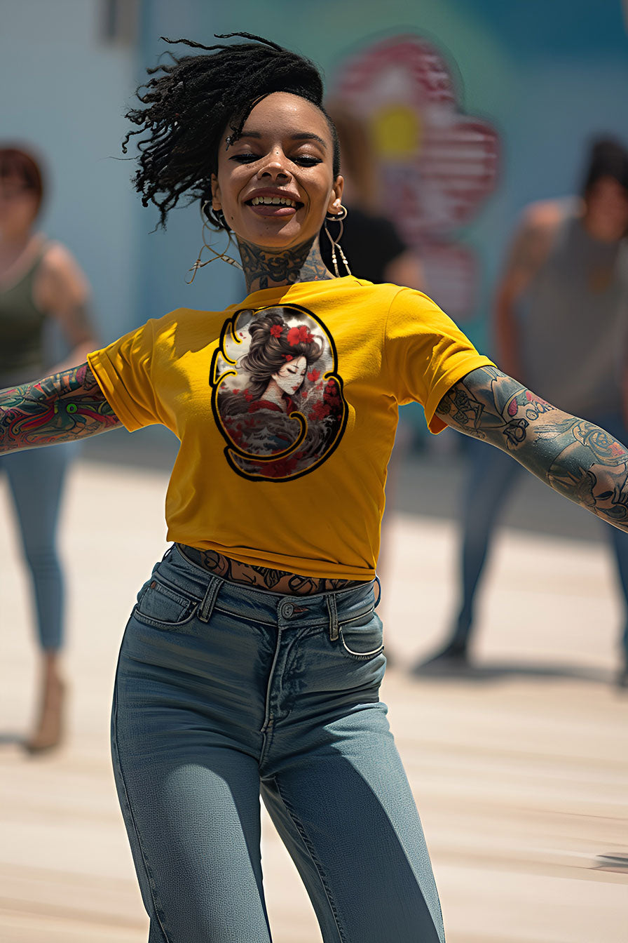 young tattooed woman wearing a yellow  graphic t-shirt featuring a Geisha print