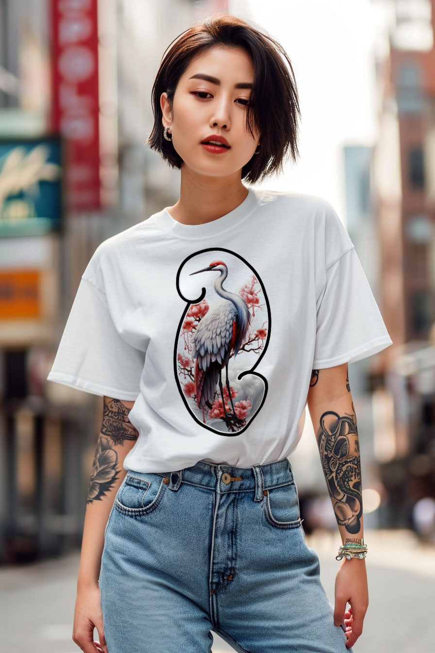 young tattooed woman wearing a white graphic t-shirt featuring a Crane print